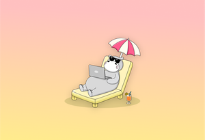 Hippo lying on a lounge chair with an umbrella and drink, working on a laptop